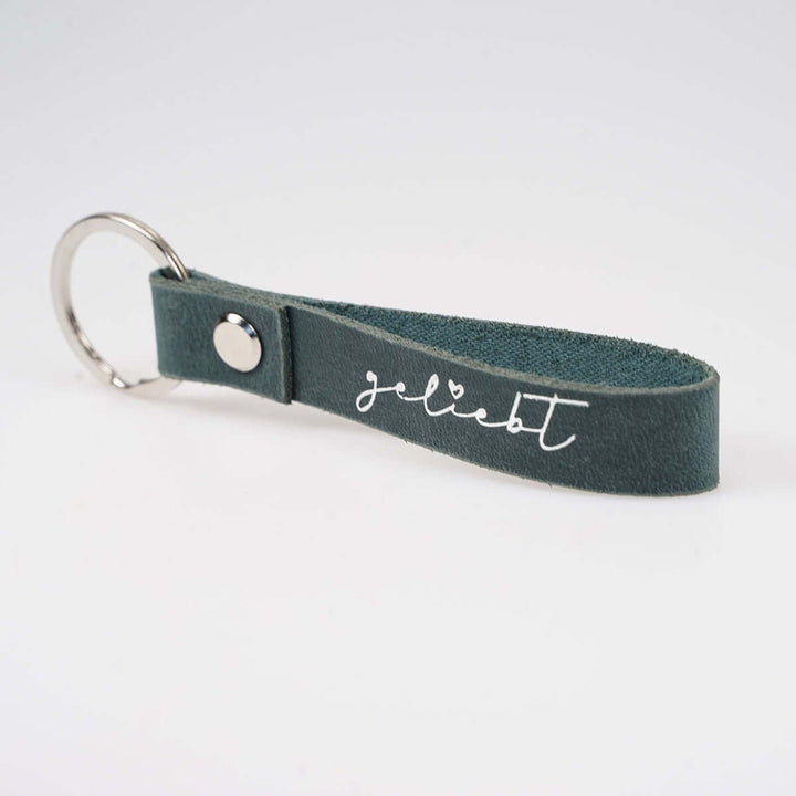 Schlüsselanhänger "geliebt" · Echtes Leder · Blau Silberglanz Prägung