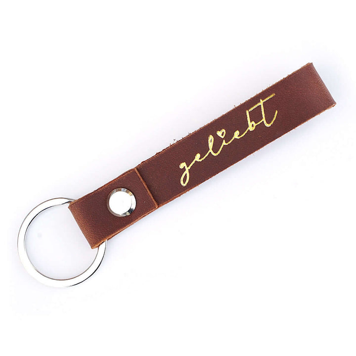 Schlüsselanhänger "geliebt" · Echtes Leder · Cognac Goldglanz Prägung